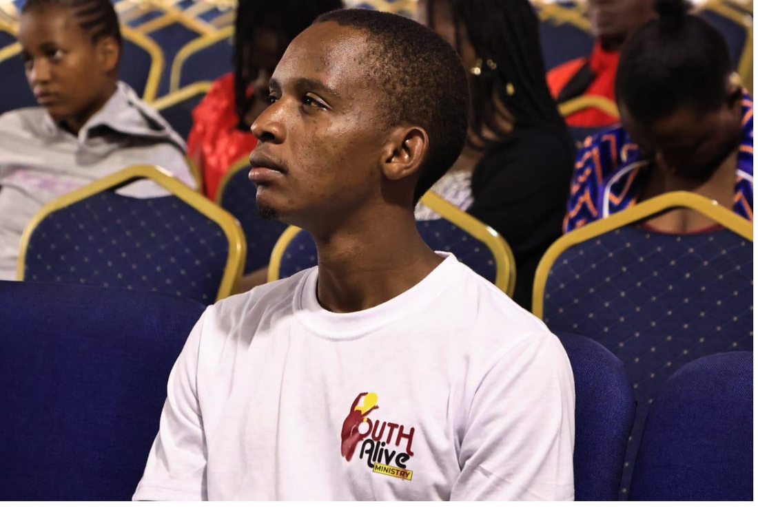 A member of Youth Alive Ministry in a Youth Alive t-shirt