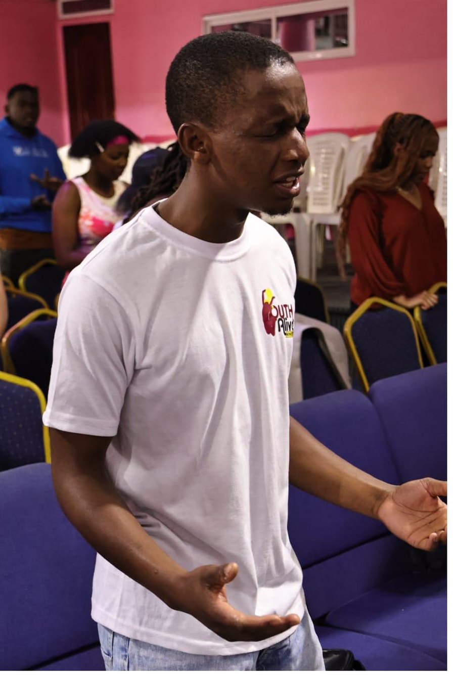 A young member in worship at Saturday Bible study